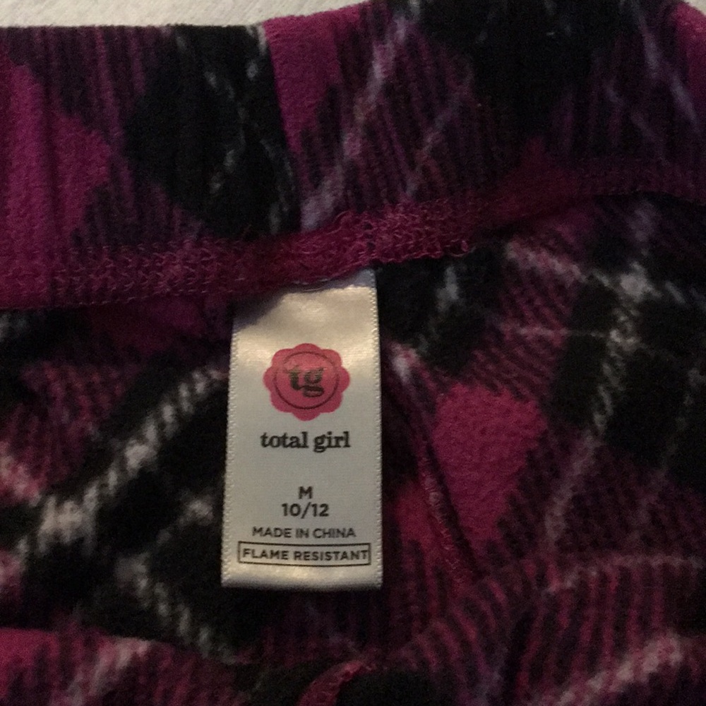 A pink, black and white striped pajama pants.
